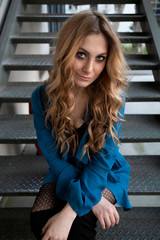 Beautiful woman with blonde long hair and blue eyes wanders the streets of Istanbul and poses for the camera