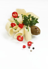 Pasta with parsley, red pepper, olive and pepper corn on white background with copy space for text