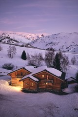 High angle shot of a homey cabin at Alpe d Huez ski resort in the French alps in France © Fabien Bazanegue/Wirestock