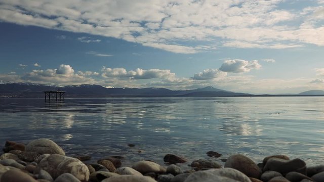 Ten rebounds on a quiet lake with mountains
