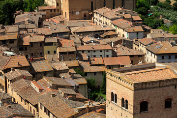 Fototapeta na wymiar San Gimignano (SI), Italy - April 10, 2017: View of San Gimignano from the top of the tower, Siena, Tuscany, Italy