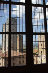 San Gimignano (SI), Italy - April 10, 2017: View of San Gimignano towers from a window, Siena, Tuscany, Italy