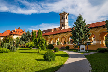 Fototapeta na wymiar The Coronation Cathedral courtyard and St. Michael Catholic Cathedral inside Alba Iulia Fortress, Transylvania, Romania