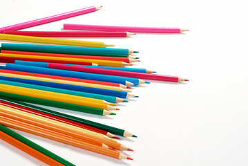 Color pencils lying on a white background.