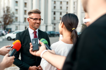Attentive listeners. Journalists conducting interview of politician. Journalism industry, live...