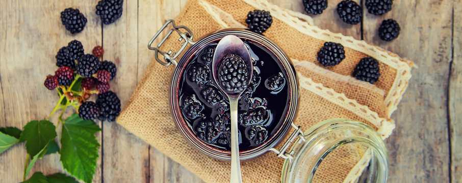 Blackberry jam in a jar. Selective focus.