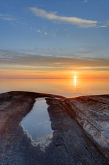 Tide pool and the ocean at sunset