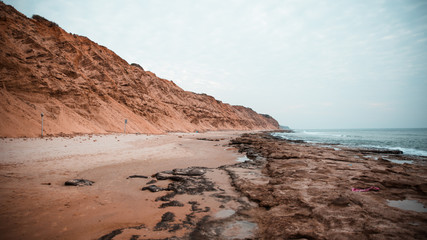 Fototapeta na wymiar empty beach with cliffs