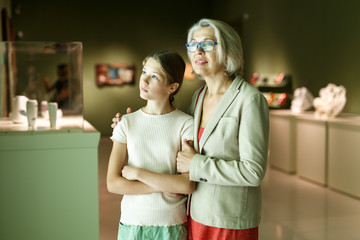 Woman and girl visiting museum