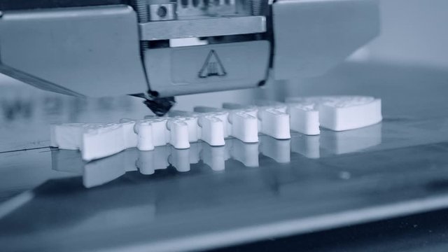 3D printer working. Fused deposition modeling, FDM. 3D printer