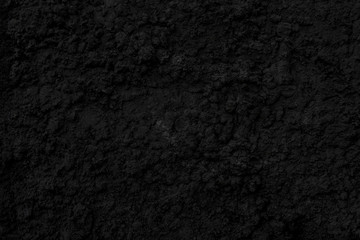 Abstract black background. Black stucco texture. Dark rough surface.