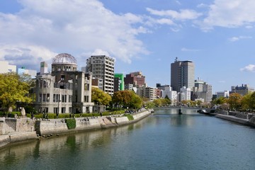 Atomic bomb dome before river with skyline, Hiroshima, Japan