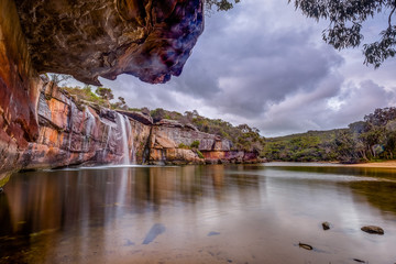 Wattamolla area located in Royal National Park including waterfalls, creek and beach