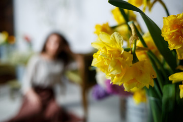 beautiful girl model with curls in a dress posing in beautiful arrangements. The beginning of...