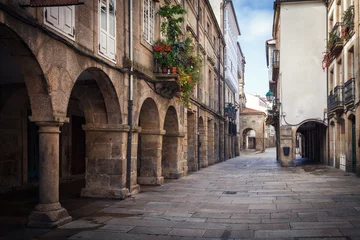  Pedestrian street and historic building facades in old town Santiago de Compostela, Spain. © jarcosa