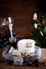 Farmer camembert cheese on the cutting board. selective focus