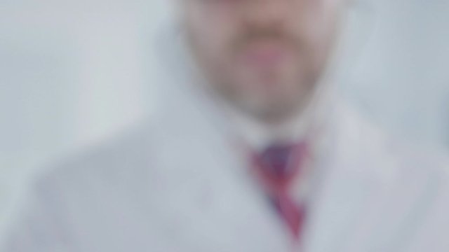 Doctor holds stethoscope bell with the Finnish flag. Healthcare in Finland