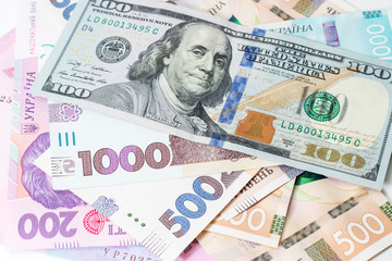Ukrainian money - 500 hryvnia banknotes USA 100 dollars bills. Finance crisis in Ukraine, the fall of the hryvnia to the dollar exchange rate. Money background