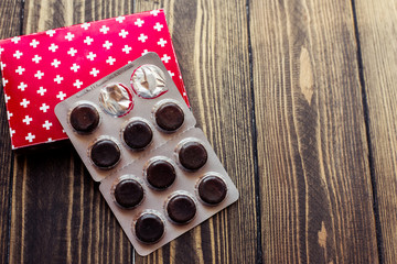 pills on wooden background