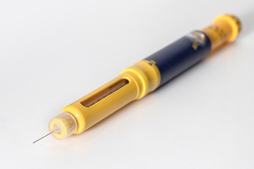 Fototapeta premium Special syringe pen on white background