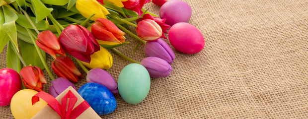 Spring tulips with colorful easter eggs.