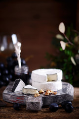 Farmer camembert cheese on the cutting board. selective focus