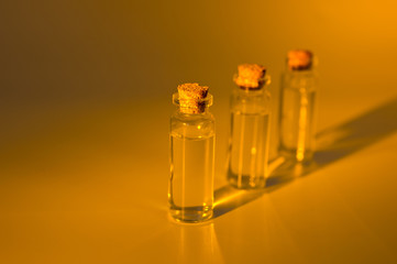 Three glass corked bottles filled with liquid. Background for science and medicine. Virus vaccine.