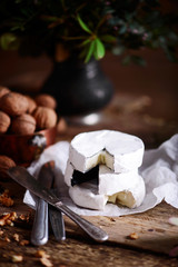 Farmer camembert cheese on the cutting board. selective focus
