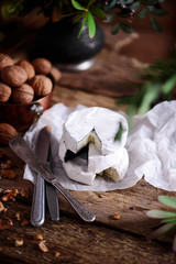Farmer camembert cheese on the cutting board. selective focus