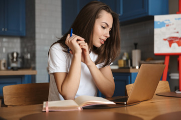 Positive optimistic woman using laptop