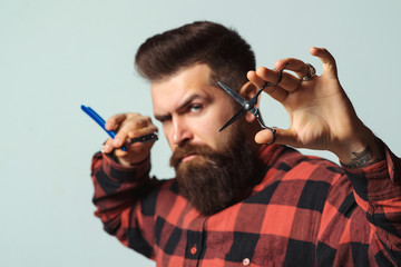 Barber shop. Stylish barber with professional tools. Brutal hipster with beard, moustache. Business...