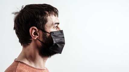 Coronavirus epidemic. Man with medical face mask for protect against infection with influenza virus...