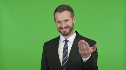 The Businessman having Talk and Waving Hand against Chroma Key