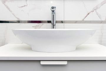 Luxury interior of bathroom with sink basin faucet. Modern design of bathroom. Modern hygienic wash basin.