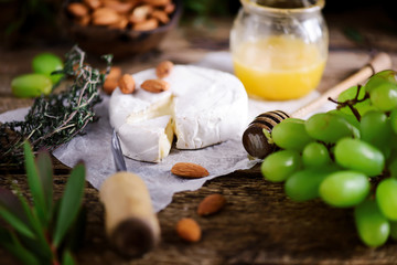 Farmer camembert cheese on the cutting board. selective focus