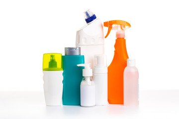 Cleaning product plastic multi-colored container for house clean on white table and isolated. household chemicals