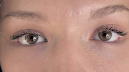 Close Up of Blinking Eyes of Curly Hair Woman