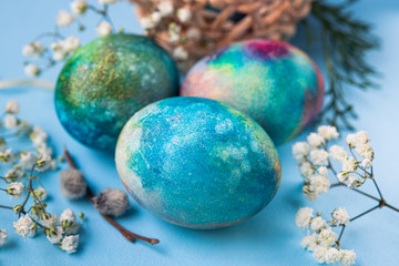 Mystical coloring eggs with spring flowers