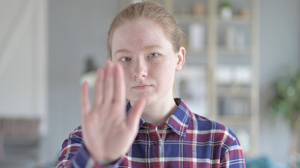 The Close Up of Young Woman Showing Stop Sign With hand