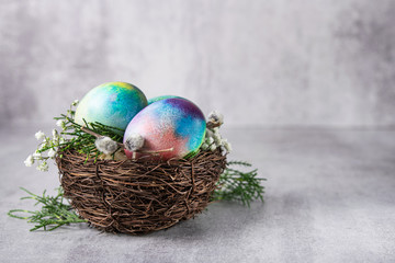 Mystical coloring Easter eggs with twigs and spring flowers