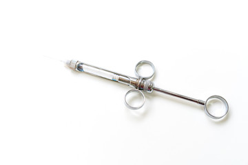 Dental instruments on a white background, syringe