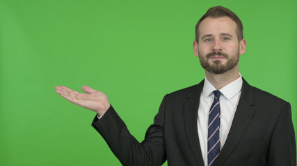 The Businessman Holding Something without theme against Chroma Key