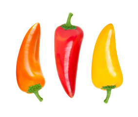 Set of three sweet peppers of different colors on a white background.