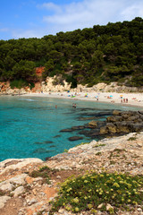 Fototapeta na wymiar Es Migjorn Gran, Menorca / Spain - June 25, 2016: The Escorxada beach and bay, Es Migjorn Gran, Menorca, Balearic Islands, Spain
