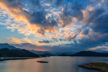 The lake at dusk, rosy clouds all over the sky