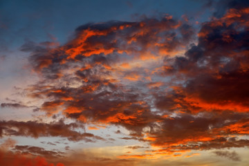 Beautiful Twilight sky background. Colorful Fiery orange and red sunset sky.