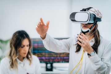 Brainwave EEG Experiment in Neuroscience Research Laboratory. Female Patient Using VR or Virtual Reality Goggles