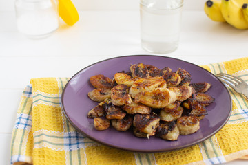 Maduros is a popular Latin American dish. Salted fried bananas with a golden brown crust. Dessert for vegetarians. Selective focus