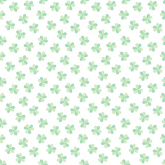 St. Patrick's Day background. Seamless pattern of light green clover leaves on white background. Illustration in flat style. Vector 8 EPS.
