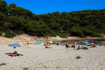 Fototapeta na wymiar Cala Trebaluger, Menorca / Spain - June 22, 2016: Cala Trebaluger beach and bay, Migjorn Gran, Menorca, Balearic Islands, Spain